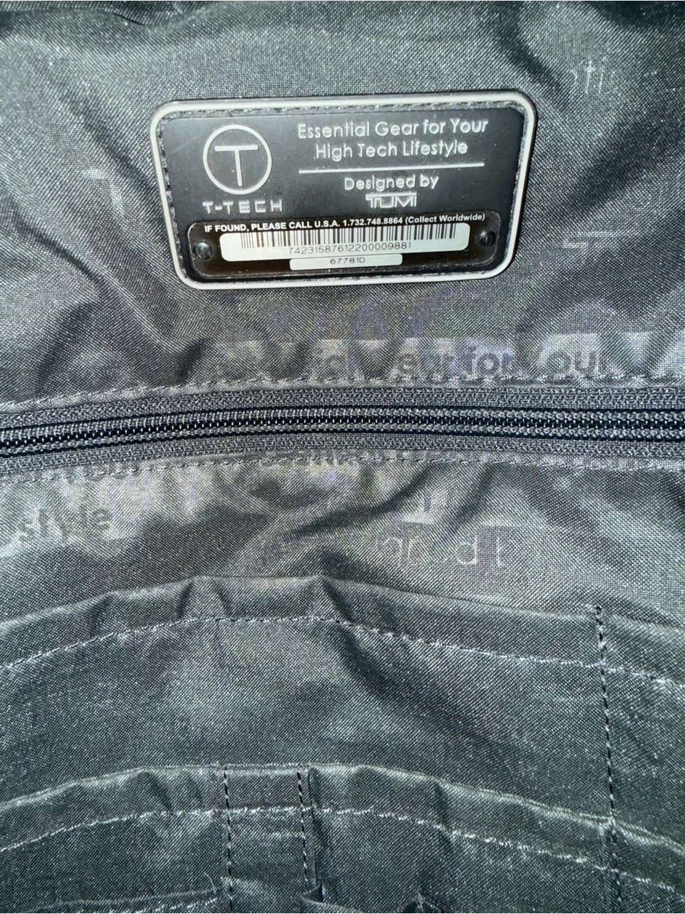 Tumi Black Tech Backpack with Subtle Red Accent